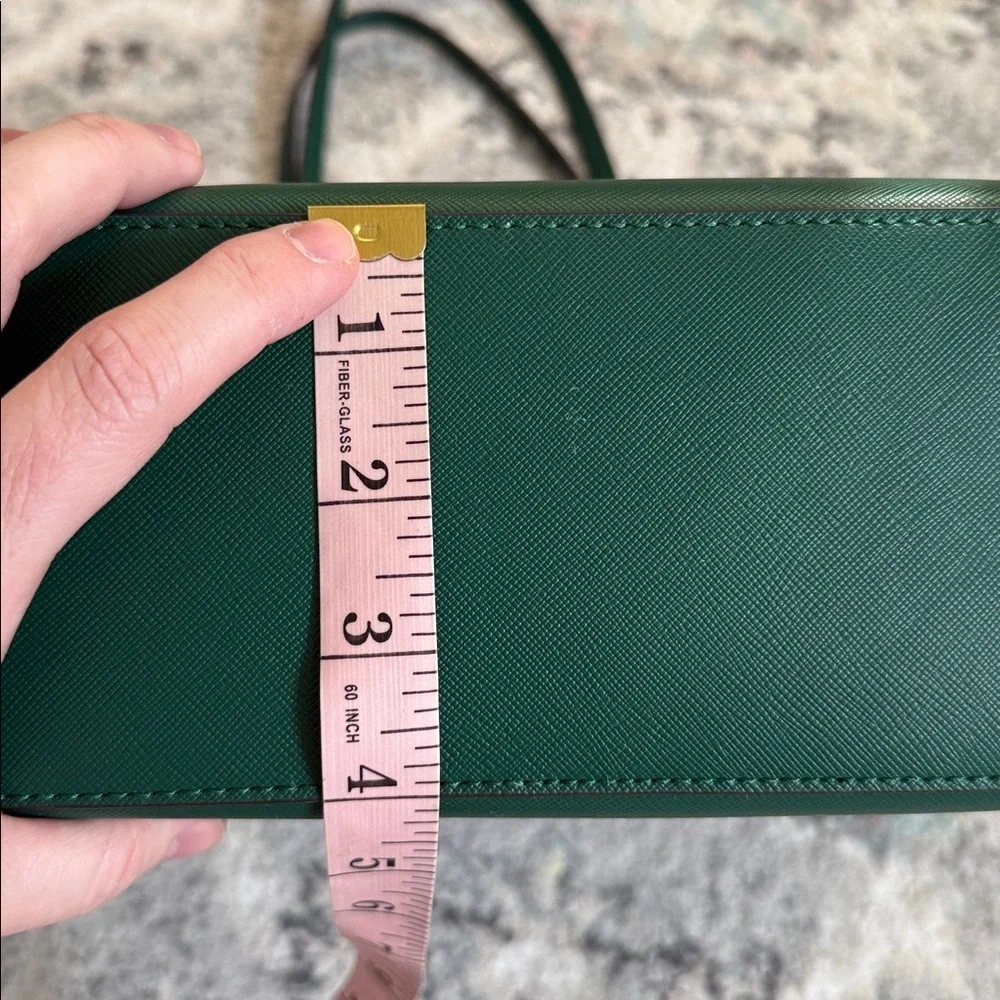 Kate Spade Brynn leather tote bag in the deep jade color with bow charm